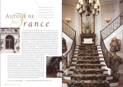 A two-page magazine spread titled "Autour de France." The left page features text, a detailed wrought iron door, and a balcony. The right page shows a grand staircase with ornate railings, floral-patterned carpet, and a large chandelier.