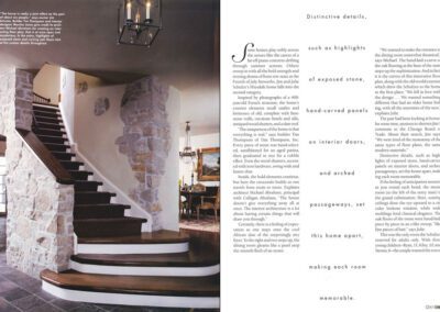 A stylish interior featuring text on a white background beside a photo of a rustic staircase with stone and wood elements. The staircase leads up to a second floor with arched windows and an elegant chandelier overhead. A dining room with wooden furniture is visible in the background.