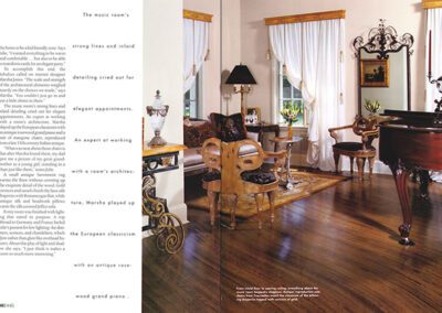 A beautifully decorated music room with antique furniture, a grand piano, a chandelier, and large windows with white curtains. The room features a polished wooden floor, elegant chairs, and a classic painting on the wall. Text is present on the left side of the image.