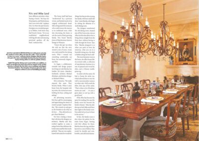 A magazine spread featuring an article on the left page and a photograph of an elegant dining room on the right. The dining room has a large wooden table set with fine china, ornate chairs, a grand chandelier, and a portrait hanging above the fireplace.